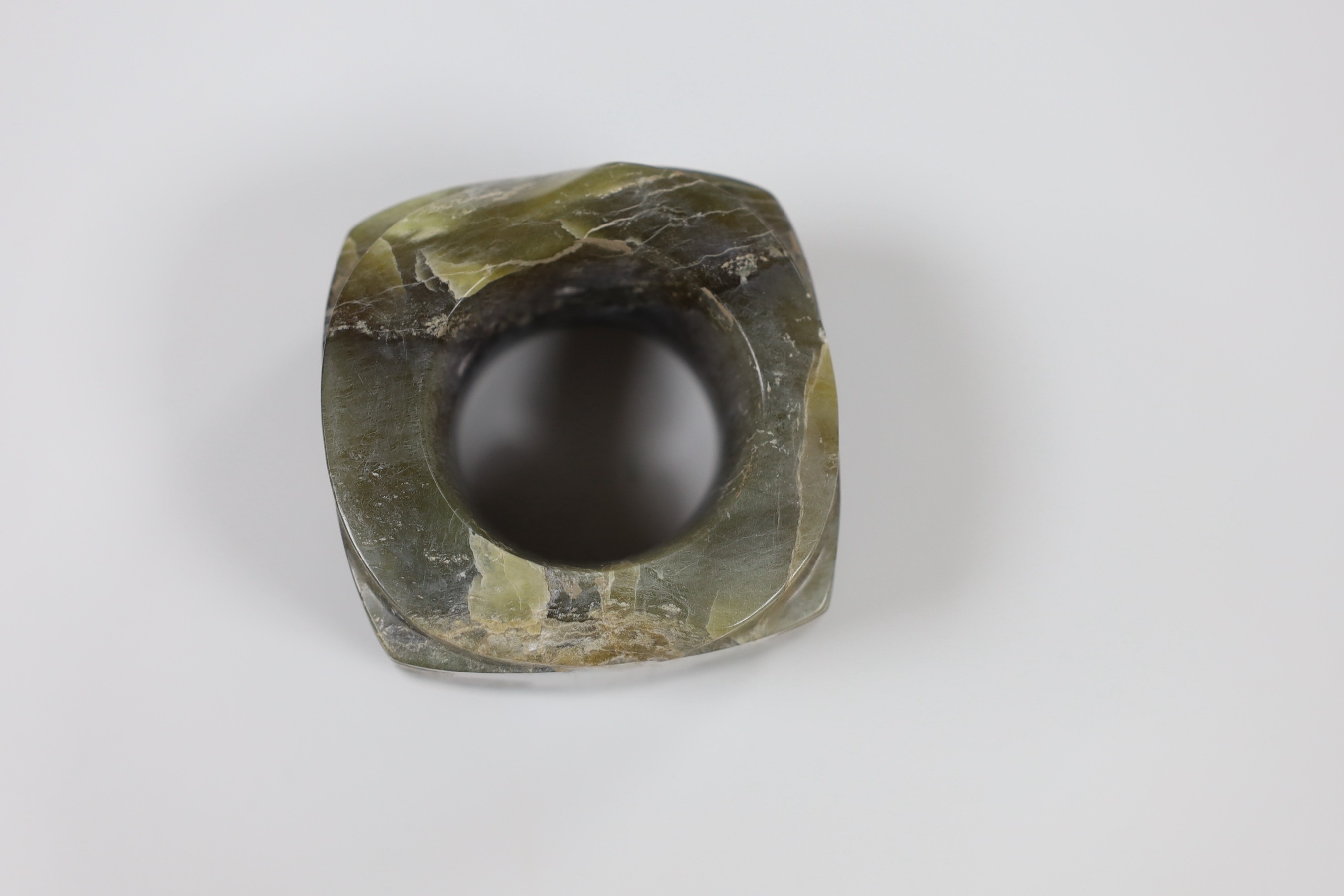 A Chinese bronze hand warmer, together with an inscribed inkstick, 16cm wide, and a hardstone carving